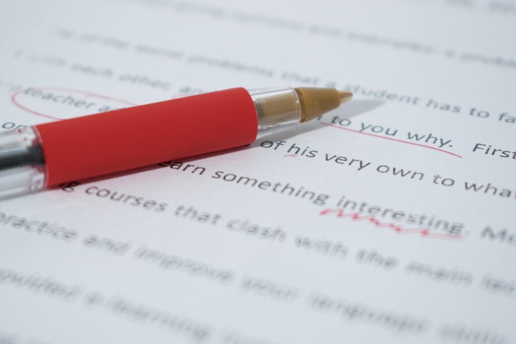 closeup photo of a pen on a book